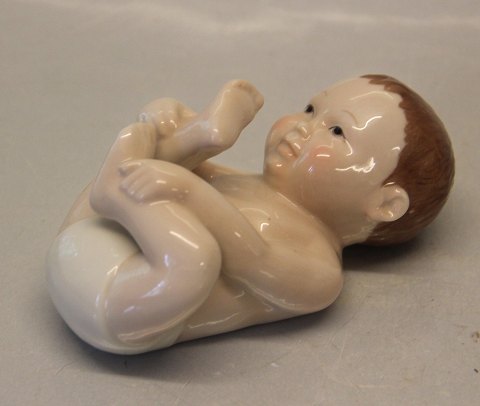 Royal Copenhagen figurine 0027 RC Happy Baby 6.5 x 12 cm, Allan Therkelsen 
(1249027)