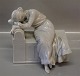 Royal Copenhagen figurine 
349 RC Woman crying on a chair  17 x 21 cm