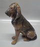 Royal Copenhagen figurine 
1322 RC Bloodhound female sitting Designed by Lauritz Jensen 1911 22.5 cm