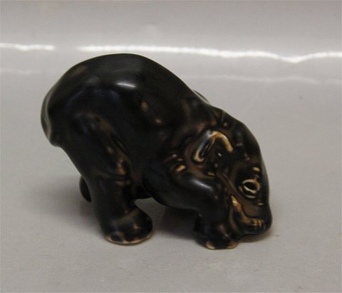 Royal Copenhagen Art Pottery
 22743 RC Elephant Cub, paying head between legs May 1982 JG