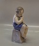 Royal Copenhagen figurine 
1744 RC Boy seated eating apple Chr. Thomsen 1915 20 x 9 cm