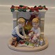 Royal Copenhagen figurine 411 RC Christmas morning - children with their gifts 
ca 8.5 x 8.5 cm
